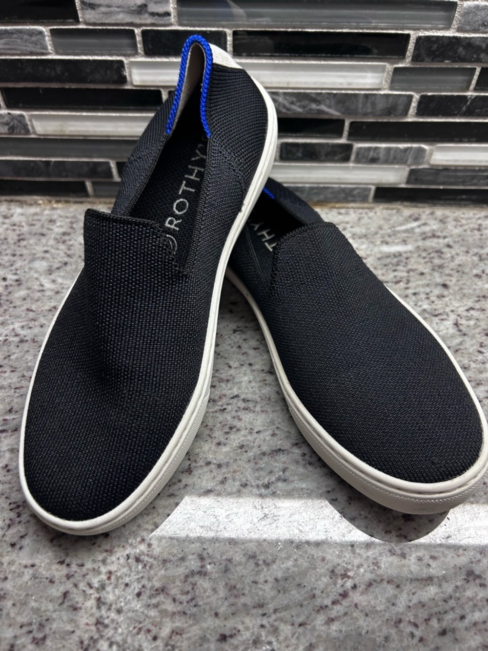 Rothy's Black Slip-On Sneakers with Blue Trim size 6